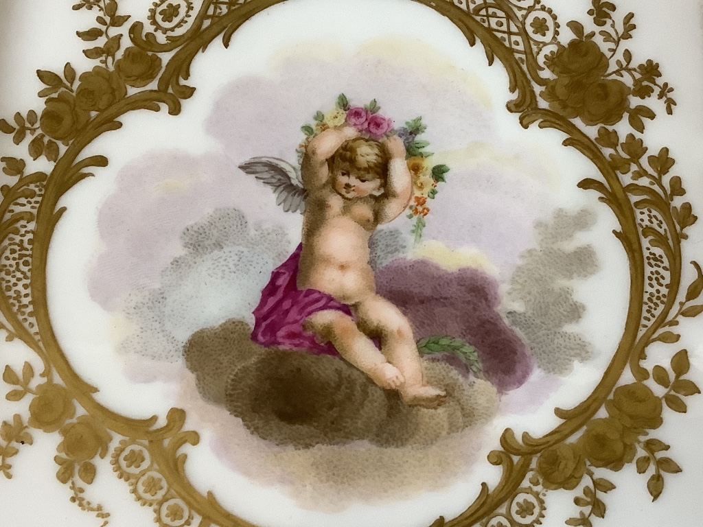 A Sevres square putti decorated dish, 15cm sq.